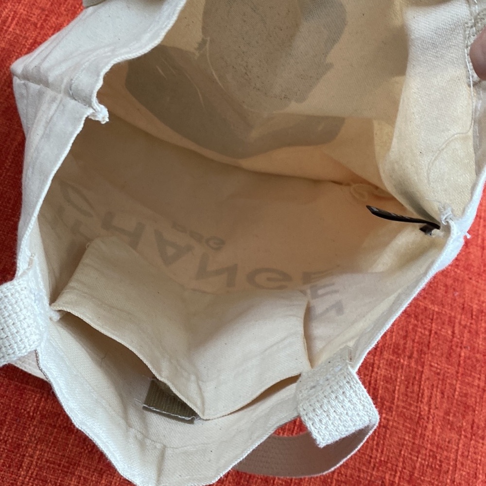 The Strand Icon RBG Time is one the side of CHANGE Tote Bag - Picture 5 of 10